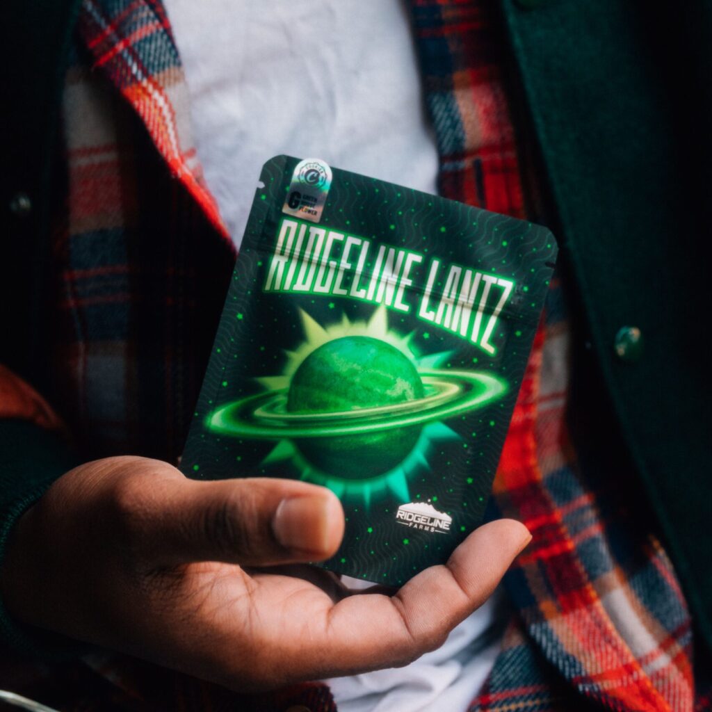 Individual holding a package of Ridgeline Lantz cannabis.