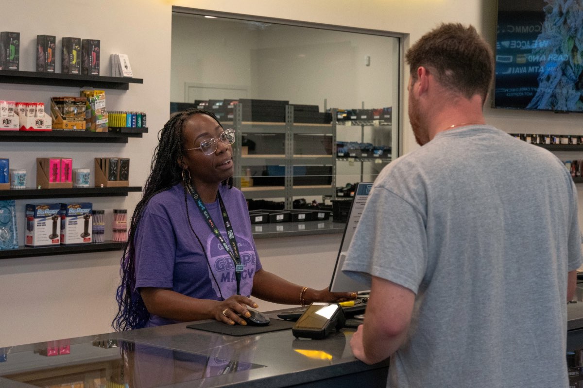 CommCan employee assisting a customer.